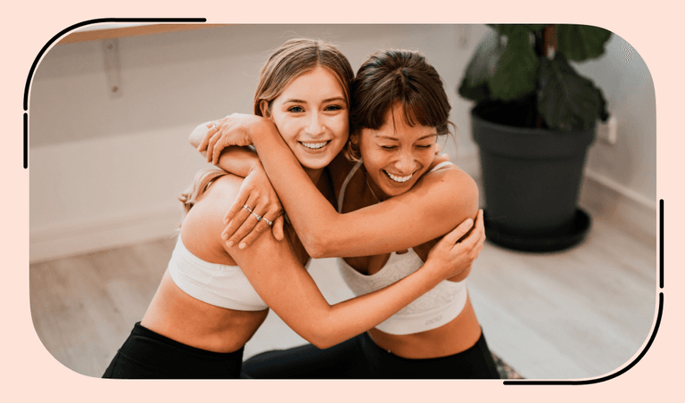 Two girls laugh during training