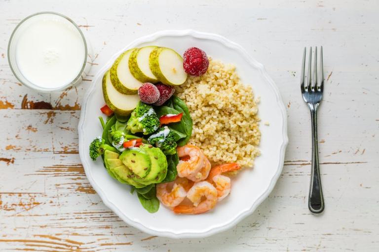 A healthy plate is 1/2 vegetables and fruits, 1/4 protein, and 1/2 grains | Shutterstock