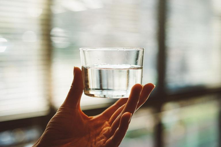 Drink water to deal with stress-induced eating | Shutterstock
