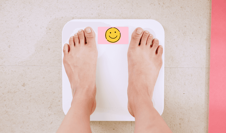 The girl on the scale sees positive results in losing excess weight