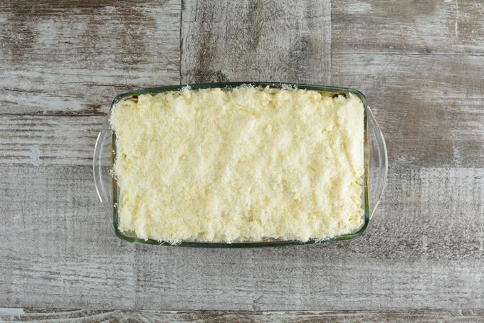 Grated parmesan is the final top of the lasagna. So it covers and hides all the layers.